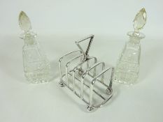 Mappin and Webb Art Deco silver plated toast rack and a pair of Edwardian cut glass perfume bottles