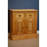 Polished pine side cabinet, single drawer above double cupboard,