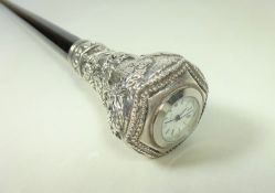 20th Century ebonised walking stick with a white metal embossed handle and clock stamped 925