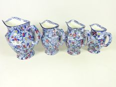 Set of three graduating Ringtons Maling ware chintz pattern jugs and one other (4)