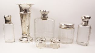 Four cut glass hallmarked silver topped dressing table jars,