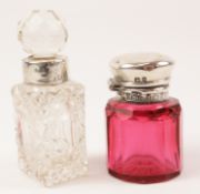 Edwardian cranberry scent bottle and cut crystal scent bottle both with hallmarked silver mounts