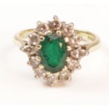 Emerald and diamond cluster hallmarked 18ct Condition Report <a href='//www.