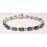 Oval sapphire and brilliant cut diamond white gold bracelet stamped 750 (sapphires approx 18 carat