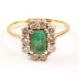 Emerald and diamond cluster ring hallmarked 18ct Condition Report <a