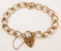 Gold curb chain bracelet the heart shaped padlock hallmarked 9ct approx Condition Report