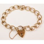 Gold curb chain bracelet the heart shaped padlock hallmarked 9ct approx Condition Report