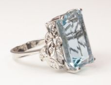 Emerald cut aquamarine white gold ring with leaf design diamond shoulders stamped 750 (aqua approx