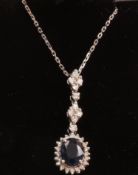 Sapphire and diamond cluster pendant with additional diamonds the white gold chain necklace