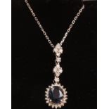 Sapphire and diamond cluster pendant with additional diamonds the white gold chain necklace