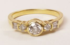 Gold ring set with round brilliant and baguette diamonds stamped 18k Condition Report