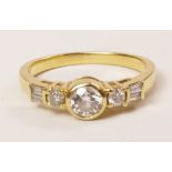 Gold ring set with round brilliant and baguette diamonds stamped 18k Condition Report