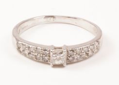 Hallmarked 18ct white gold ring set with princess cut central diamond and twenty further diamonds