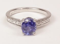 Oval sapphire white gold ring with five brilliant cut diamonds to each shoulder hallmarked 18ct
