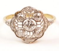 Art Deco ring set with rim set central diamond,