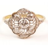 Art Deco ring set with rim set central diamond,