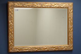 Bevelled mirror in moulded gilt frame,