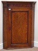 George III oak corner cabinet, single panelled door banded in mahogany, figured mahogany frieze,