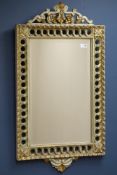 Italian style carved wood parcel gilt framed mirror with bevelled glass,