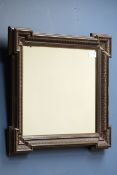 Early 20th century walnut framed mirror, gilt moulded decoration,
