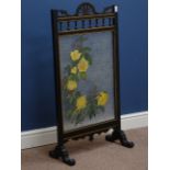 Early 20th century black painted and gilt firescreen with mottled glass panel, painted with flowers,