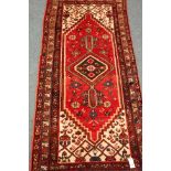 Persian Shiraz red ground rug with pole medallion,