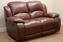 Two seat reclining sofa upholstered in brown leather,