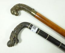 Early to mid 20th Century carved horn dragons head handle walking stick and another walking stick