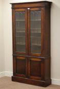 Early 20th century oak bookcase, two lead glazed doors above double cupboard, W92cm, H178cm,