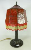 Leaded and mottled glass table lamp with naturalistic base,