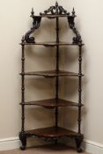 Victorian rosewood serpentine five tier corner etarge, turned and carved scrolling supports, W67cm,