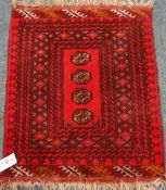Small Persian mat rug, red ground with four guls,