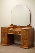 Art Deco period figured walnut dressing table, seven drawers, shaped mirror back, W114cm, H153cm,