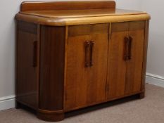 Art Deco oak and walnut sideboard, two double cupboards and cupboard to each end, curved corners,