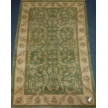 Large green ground Indian wool rug,