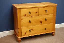 Pine chest fitted with two short and three long drawers, on bun feet,