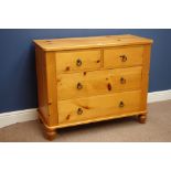 Pine chest fitted with two short and three long drawers, on bun feet,