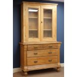 Edwardian walnut satin walnut three drawer chest with pine two door bookcase top, W122cm,