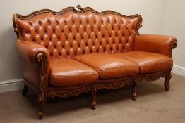 Italian carved walnut framed three piece lounge suite upholstered in tan leather - three seat sofa