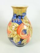 Old Tupton Ware Moorcroft style vase with berry and pomegranate tubeline decoration, H29.