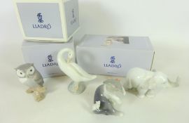 Four Lladro animal figures; Owl, Cat, Elephant and a Swan,