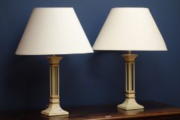 Pair of painted metal table lamps with gilt borders,