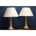 Pair of painted metal table lamps with gilt borders,