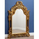 Wall mirror in floral gilt frame with shaped top, W90cm,