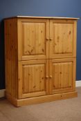 Large waxed pine tallboy fitted with four cupboards, W109cm, D61cm,