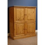 Large waxed pine tallboy fitted with four cupboards, W109cm, D61cm,