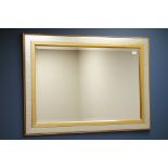 Rectangular bevelled edge mirror in silver and gilt frame,