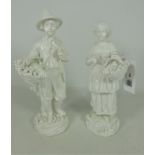 Pair of 19th Century Dresden blanc de chine figures of a male and female with fruit and flower