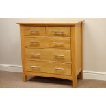 Light oak chest fitted with two short and three long drawers,