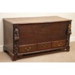Early 19th century oak mule chest, hinged lid, with three drawers, carved foliate mounts and mask,